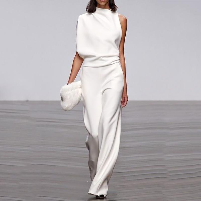 Rygglös plisserad jumpsuit | enfärgad & ärmlös | utsvängd passform med oregelbunden fåll