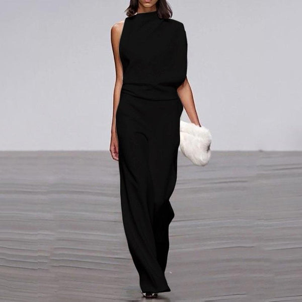 Rygglös plisserad jumpsuit | enfärgad & ärmlös | utsvängd passform med oregelbunden fåll